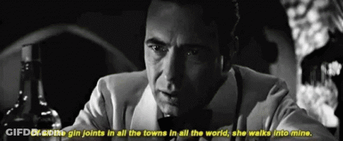 A Black And White Photo Of A Man With A Bottle Of Alcohol And The Words Of All The Gin Joints In All The Towns GIF