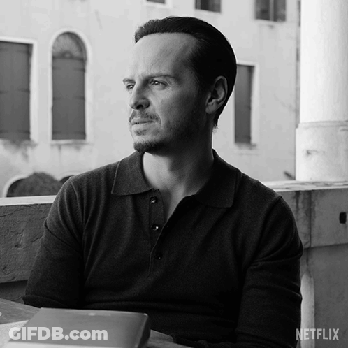 A Black And White Photo Of A Man With A Netflix Logo GIF