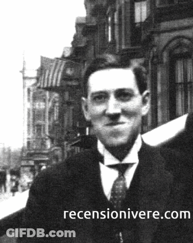 A Black And White Photo Of A Man With A Reviewonivere.com Website Written Below Him GIF