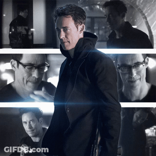 A Black And White Photo Of A Man With Glasses And A Black Jacket GIF