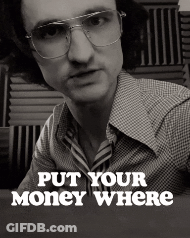A Black And White Photo Of A Man With Glasses And The Words Put Your Money Where Below Him GIF