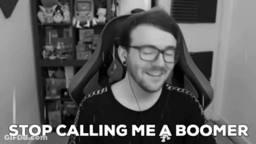 A Black And White Photo Of A Man With Glasses And The Words " Stop Calling Me A Boomer " Behind Him GIF