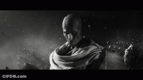 A Black And White Photo Of A Man With Glowing Red Eyes GIF