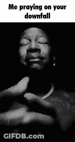 A Black And White Photo Of A Man With His Eyes Closed And The Caption " Me Praying On Your Downfall " GIF