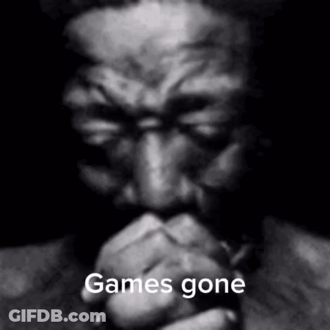A Black And White Photo Of A Man With His Hands Folded And The Words `` Games Gone '' Written On It . GIF