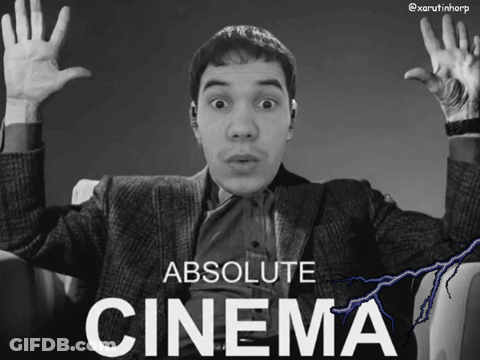 A Black And White Photo Of A Man With His Hands In The Air And The Caption Absolute Cinema GIF