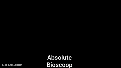 A Black And White Photo Of A Man With His Hands In The Air And The Words Absolute Bioscoop On The Bottom GIF
