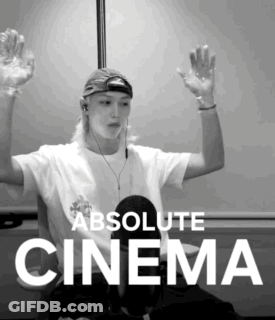 A Black And White Photo Of A Man With His Hands In The Air And The Words Absolute Cinema Below Him GIF