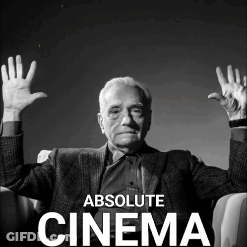 A Black And White Photo Of A Man With His Hands In The Air And The Words Absolute Cinema Below Him GIF