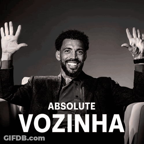 A Black And White Photo Of A Man With His Hands In The Air And The Words Absolute Vozinha Behind Him GIF