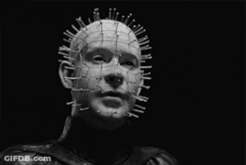 A Black And White Photo Of A Man With Nails In His Head And The Words " Your Holes Apart " GIF