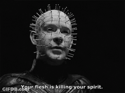 A Black And White Photo Of A Man With Spikes On His Head And The Caption Your Flesh Is Killing Your Spirit GIF