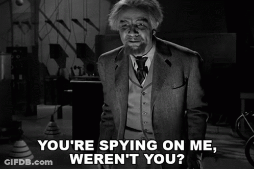 A Black And White Photo Of A Man With The Caption " You 'Re Spying On Me Weren 'T You " GIF