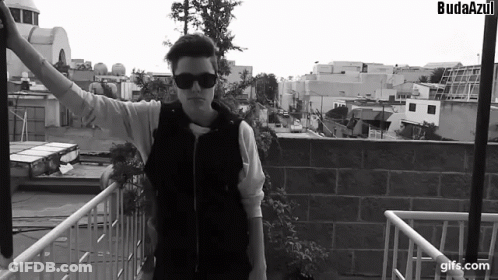 A Black And White Photo Of A Man With The Word Budaazul On The Bottom Right GIF