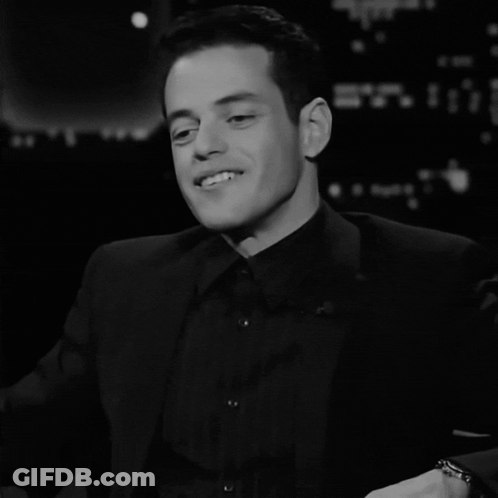 A Black And White Photo Of A Man With The Word Et On The Bottom Left GIF