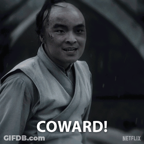 A Black And White Photo Of A Man With The Words Coward Written Below Him GIF