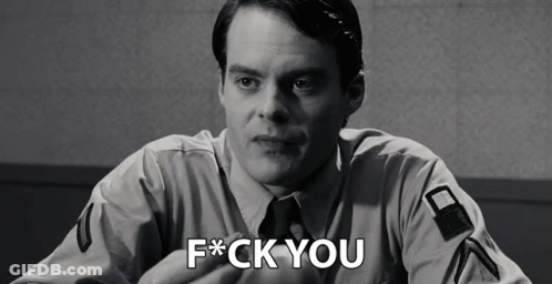 A Black And White Photo Of A Man With The Words F * Ck You On His Chest GIF