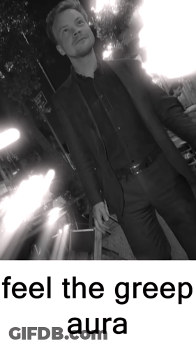 A Black And White Photo Of A Man With The Words Feel The Greep Aura GIF