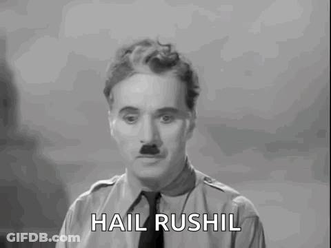 A Black And White Photo Of A Man With The Words Hail Rushil Above Him GIF