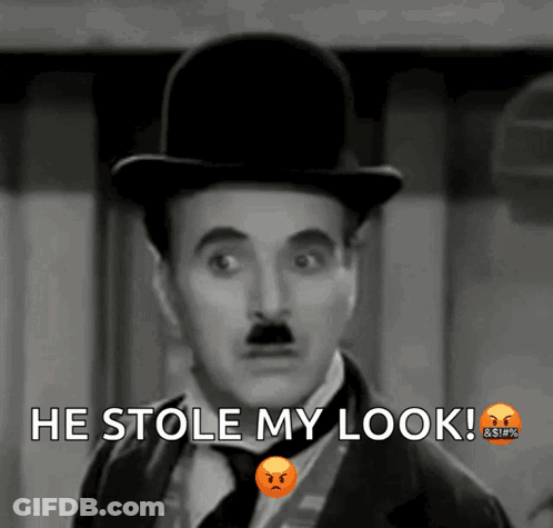 A Black And White Photo Of A Man With The Words He Stole My Look Above Him GIF