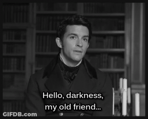 A Black And White Photo Of A Man With The Words Hello Darkness My Old Friend GIF
