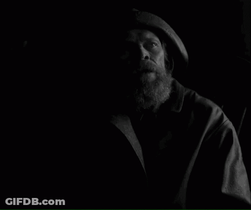 A Black And White Photo Of A Man With The Words How Long Have We Been On This Rock Below Him GIF