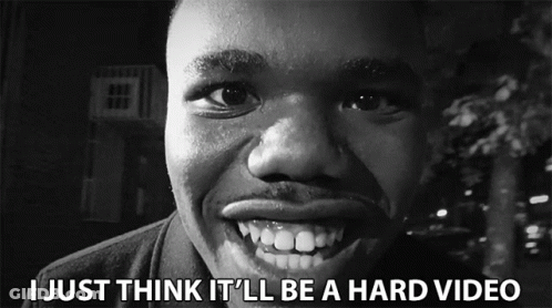 A Black And White Photo Of A Man With The Words " I Just Think It 'Ll Be A Hard Video " Below Him GIF