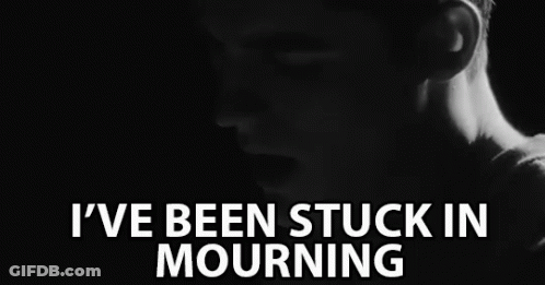 A Black And White Photo Of A Man With The Words " I 'Ve Been Stuck In Mourning " Above Him GIF