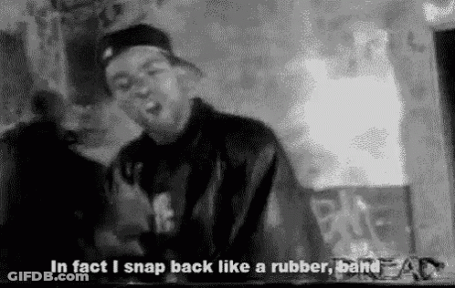 A Black And White Photo Of A Man With The Words `` In Fact I Snap Back Like A Rubber Band '' Written Below Him . GIF