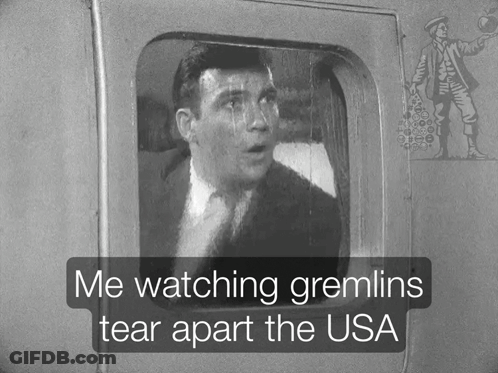 A Black And White Photo Of A Man With The Words Me Watching Gremlins Tear Apart The Usa GIF