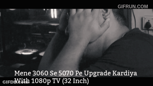 A Black And White Photo Of A Man With The Words Mene 3060 Se 5070 Pe Upgrade Kardiya With 1080P Tv 32 Inch On The Bottom GIF