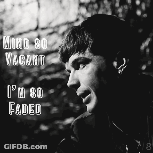 A Black And White Photo Of A Man With The Words Mind So Vacant I 'M So Faded Above Him GIF