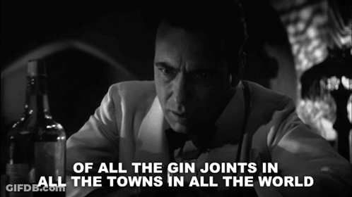 A Black And White Photo Of A Man With The Words Of All The Gin Joints In All The Towns In All The World Behind Him GIF