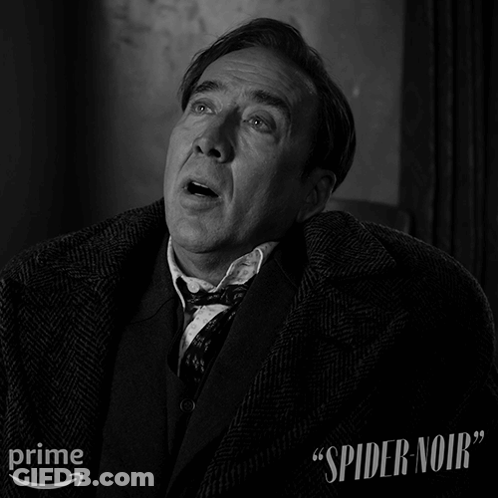 A Black And White Photo Of A Man With The Words " Spider Noir " On The Bottom Right GIF