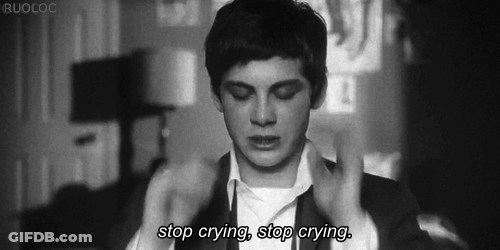 A Black And White Photo Of A Man With The Words Stop Crying Stop Crying Below Him GIF