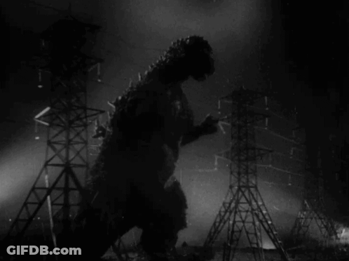 A Black And White Photo Of A Monster Standing In Front Of A Bunch Of Power Lines GIF