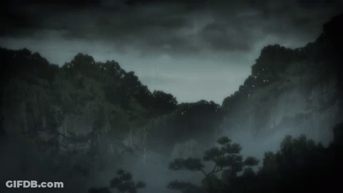 A Black And White Photo Of A Mountain Range With Trees GIF