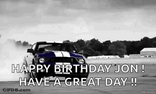 A Black And White Photo Of A Mustang Drifting On A Race Track . GIF