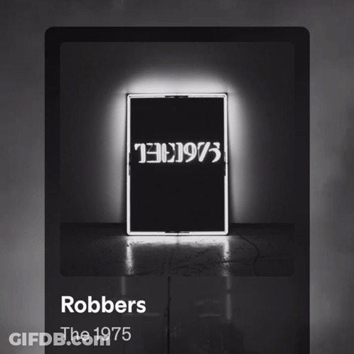 A Black And White Photo Of A Neon Sign That Says Robbers The 1975 GIF