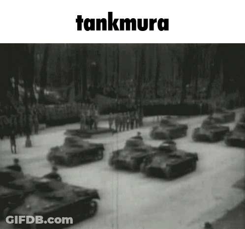 A Black And White Photo Of A Parade Of Tanks With The Words Tankmura Above It GIF