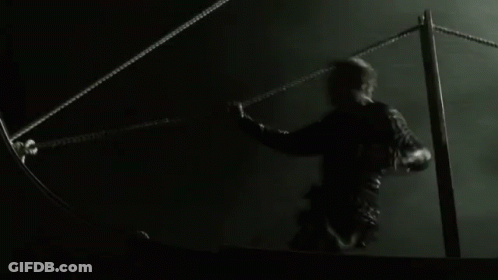 A Black And White Photo Of A Person Holding A Rope In The Water GIF