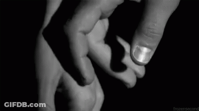 A Black And White Photo Of A Person Holding Another Person 'S Hand . GIF
