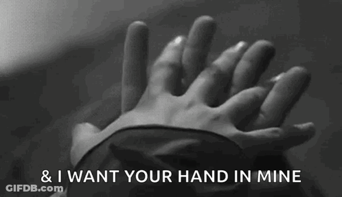 A Black And White Photo Of A Person Holding Another Person 'S Hand With The Words " And I Want Your Hand In Mine " Above GIF