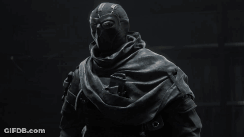 A Black And White Photo Of A Person In A Mask GIF