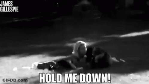 A Black And White Photo Of A Person In The Water With The Words Hold Me Down Below Them GIF