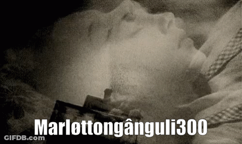 A Black And White Photo Of A Person Laying In A Coffin With The Words Marlottonganguli300 Above It GIF