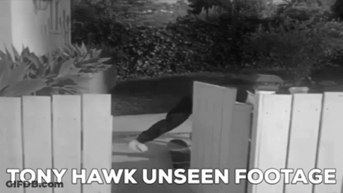 A Black And White Photo Of A Person Opening A Gate With The Words Tony Hawk Unseen Footage Below It GIF