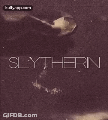 A Black And White Photo Of A Person Pouring Something Into A Glass With The Word Slytherin On It . GIF