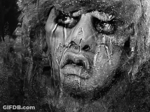 A Black And White Photo Of A Person 'S Face GIF