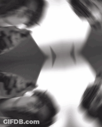 A Black And White Photo Of A Person 'S Face And A White Background GIF